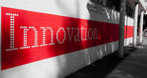Stock image of the word Innovation on the side of a building